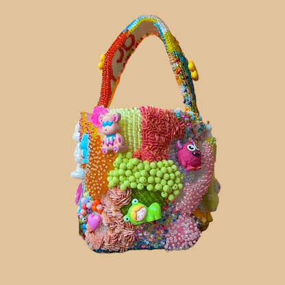 Hand-Beaded Vibrant Bucket Bag with Statement Charms and Colorful Embroidery